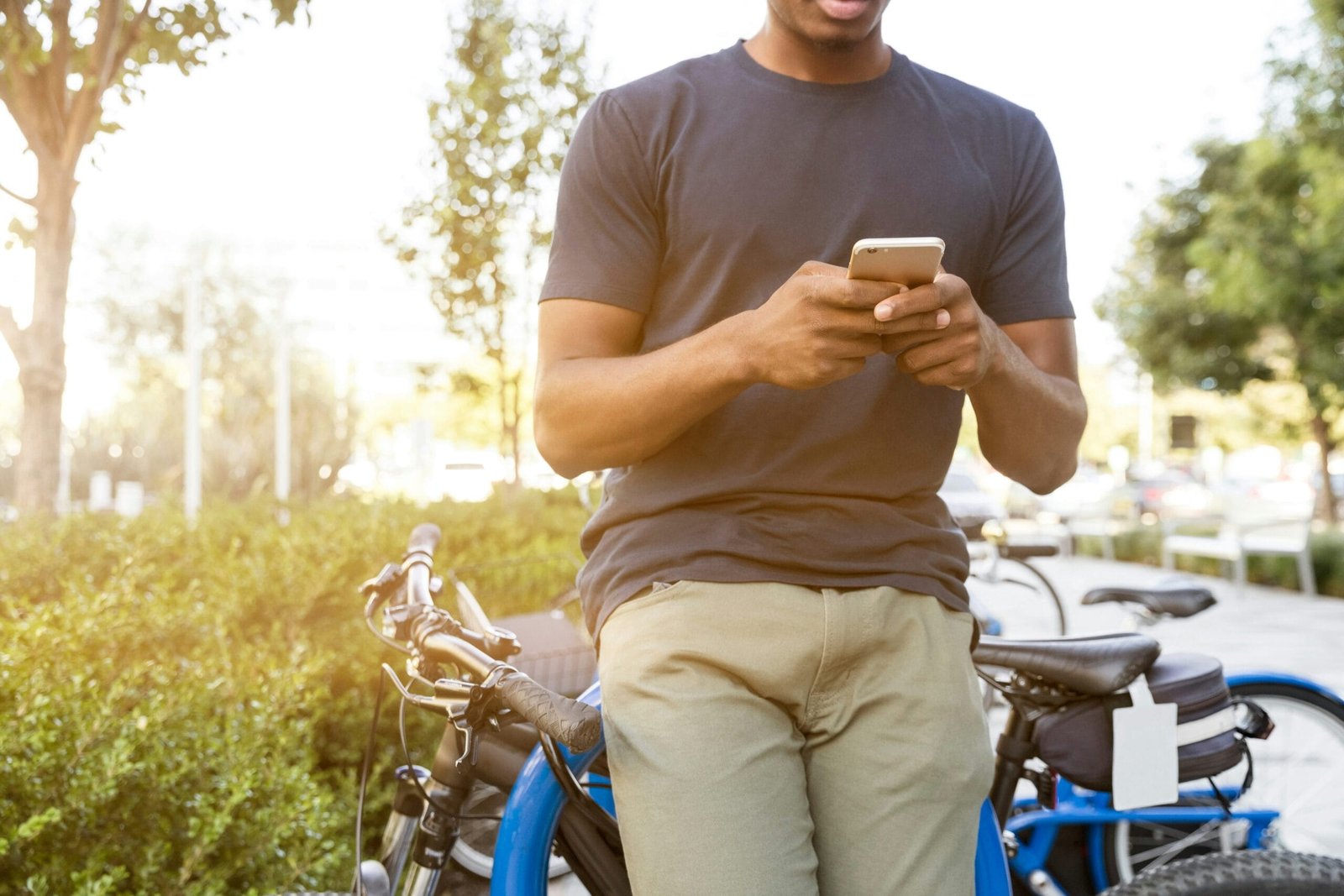 man holding smartphone leaning