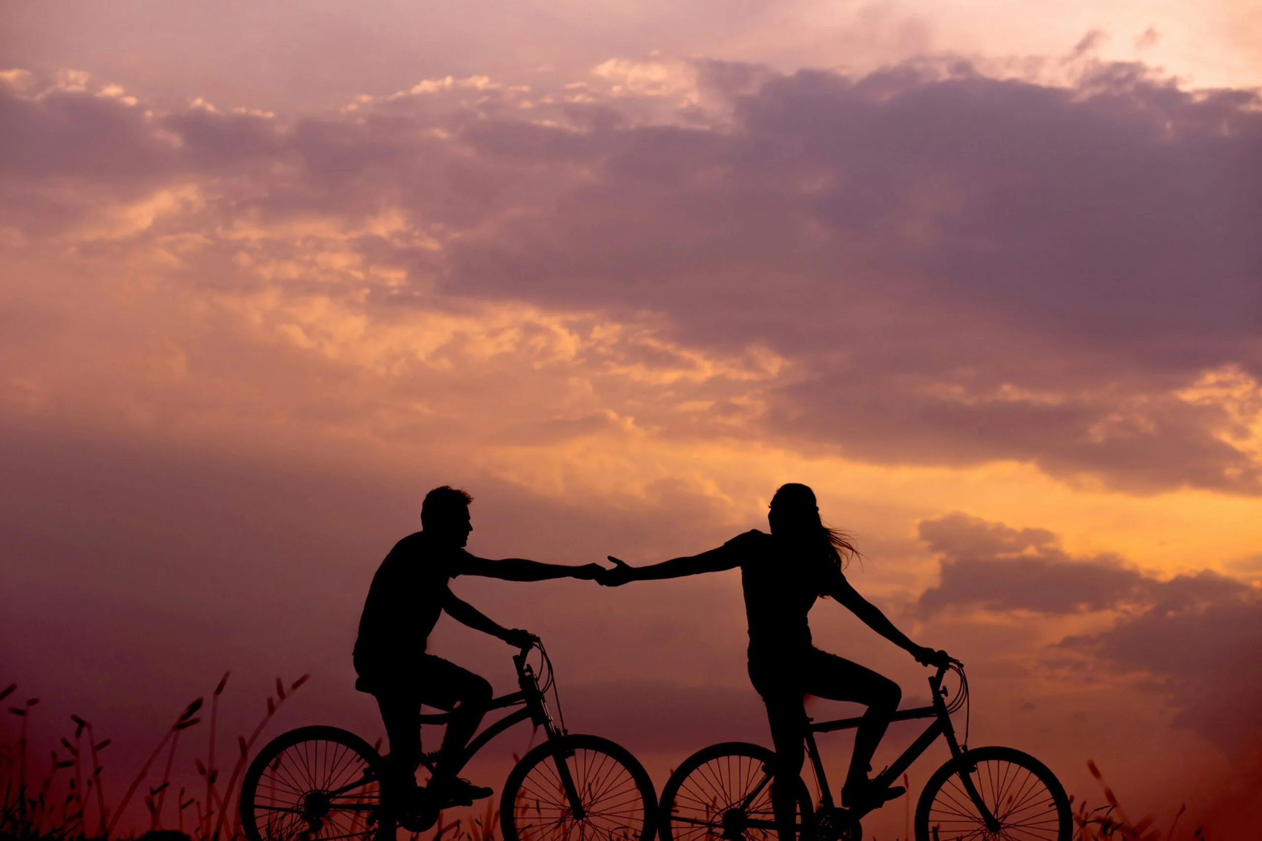 woman on bike reaching